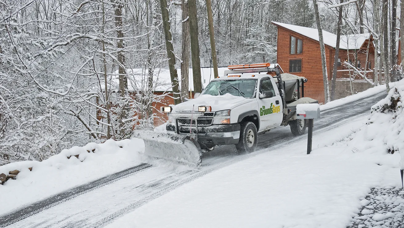 Removing snow using snowblower.